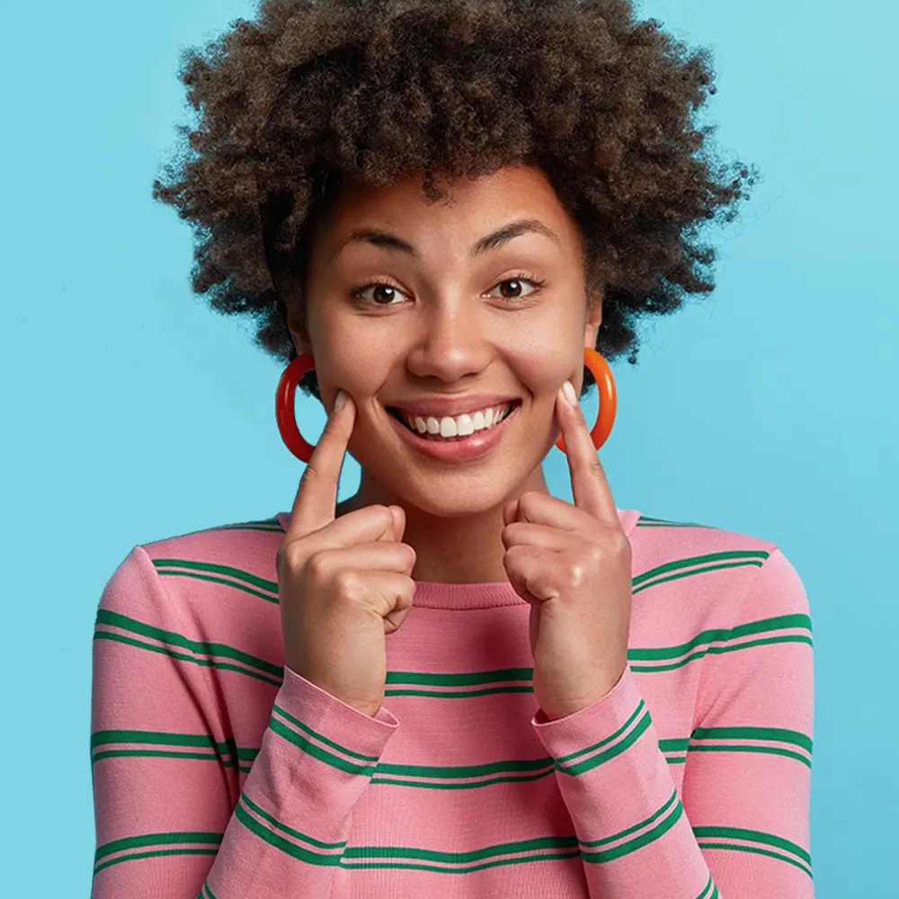 Young girl smiling happy with healthy teeth benefiting from general dentistry