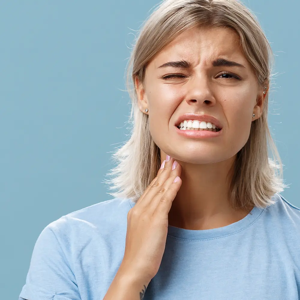 Blond woman with toothache needs emergency dentistry